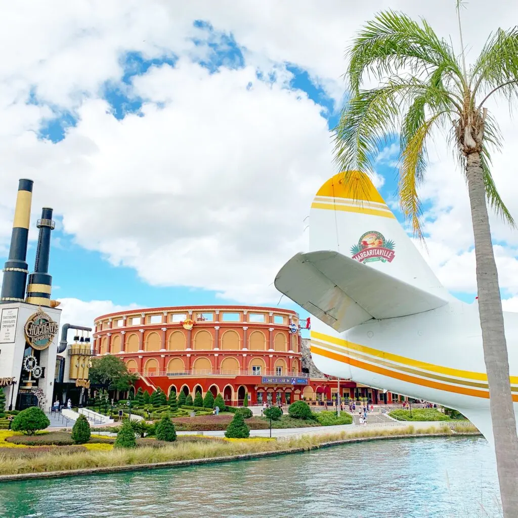 margaritaville plane tail in front of Hard Rock Cafe with palm tree nearby