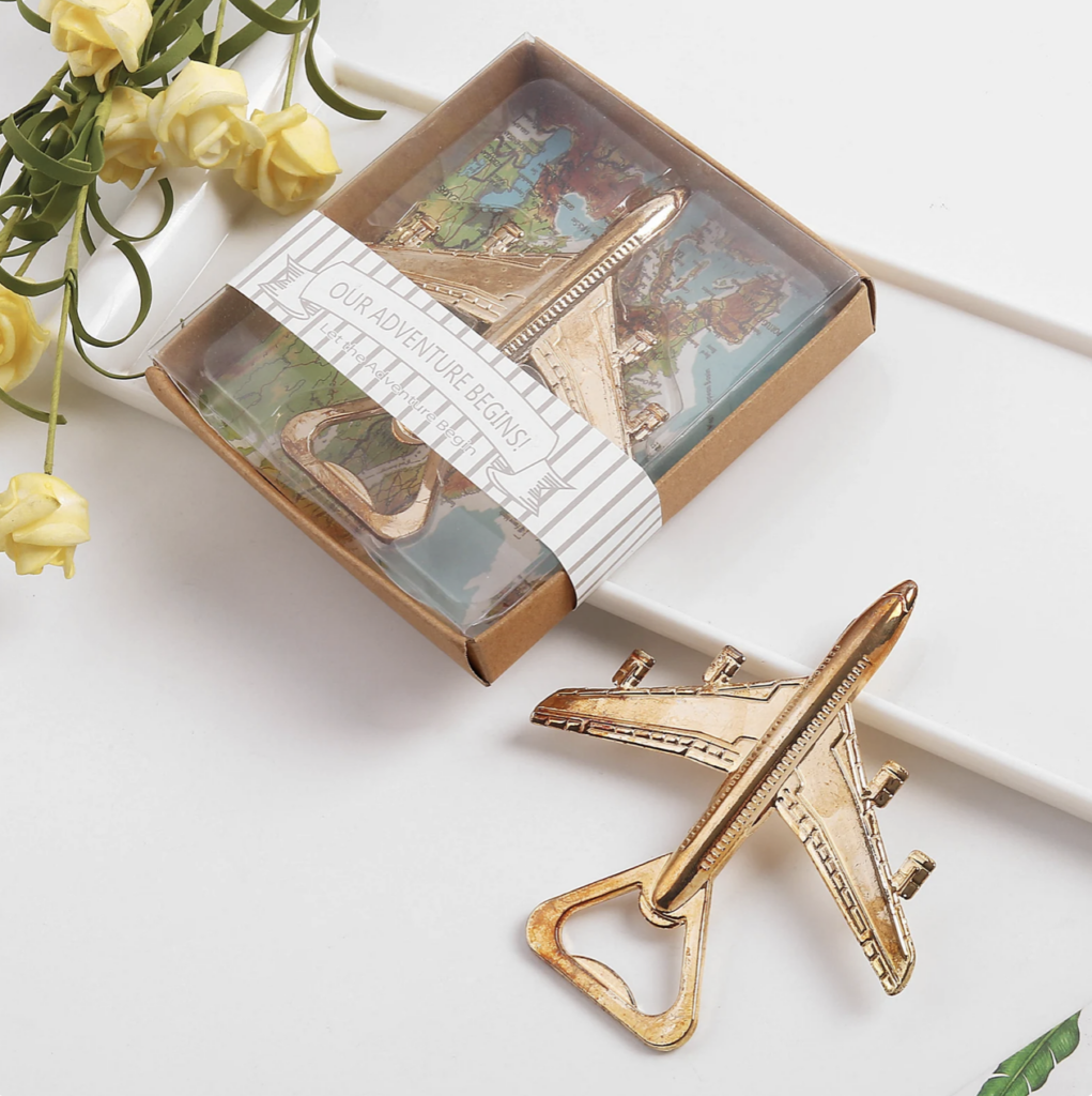 gold bottle opener in the shape of an airplane