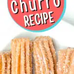 churros covered in sugar against white background