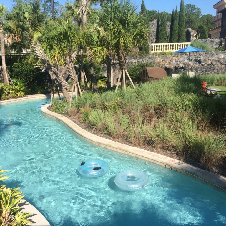 lazy river with inner tubes floating at four seasons orlando resort