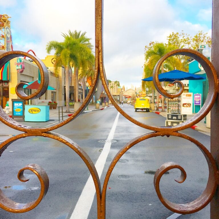 looking through entrance gate of Universal Studios Orlando into empty theme park