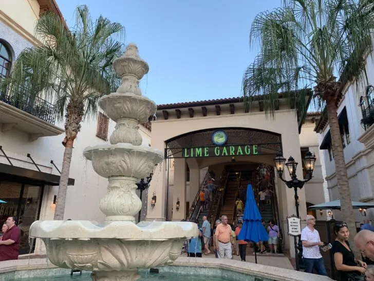 sign for lime garage at Disney Springs with ornate fountain in foreground