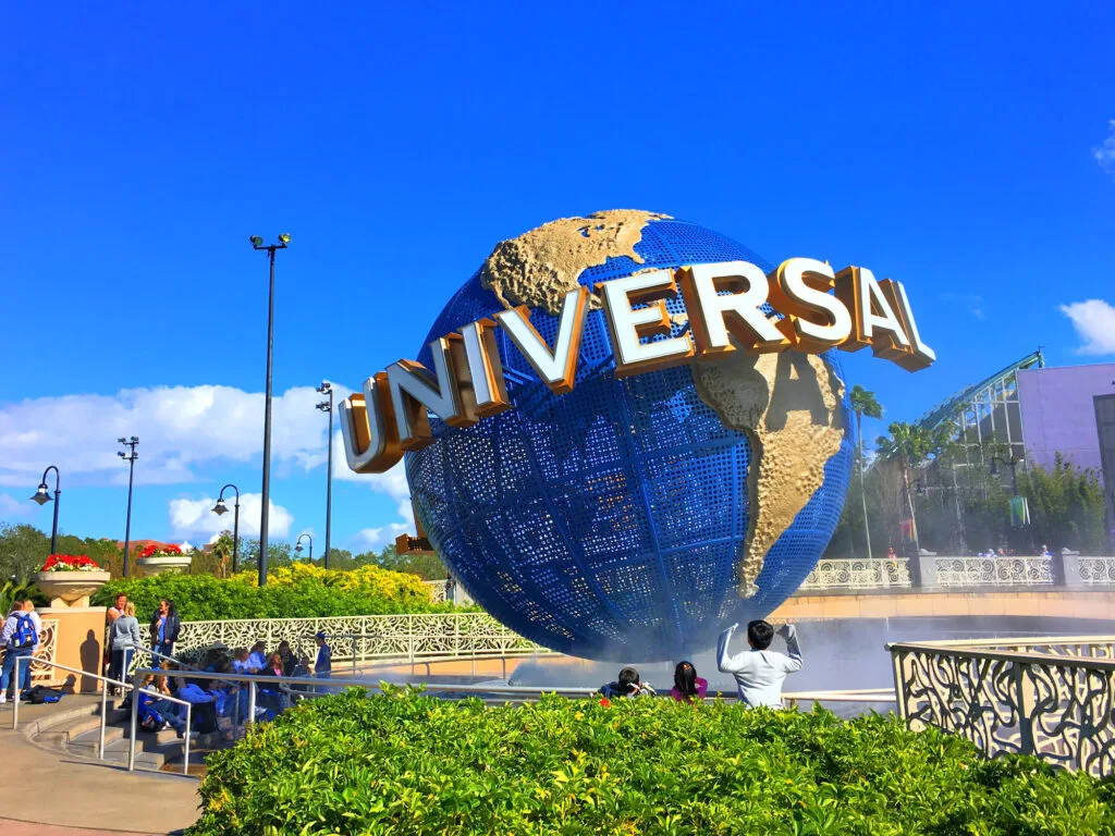 Universal globe sign against blue sky at Universal Orlando resort