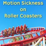 theme park guests in a ride car on a red roller coaster track against blue sky background