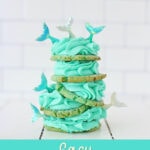 stack of pretty turquoise mermaid cookies against white background