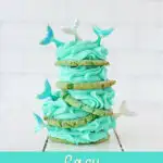 stack of pretty turquoise mermaid cookies against white background