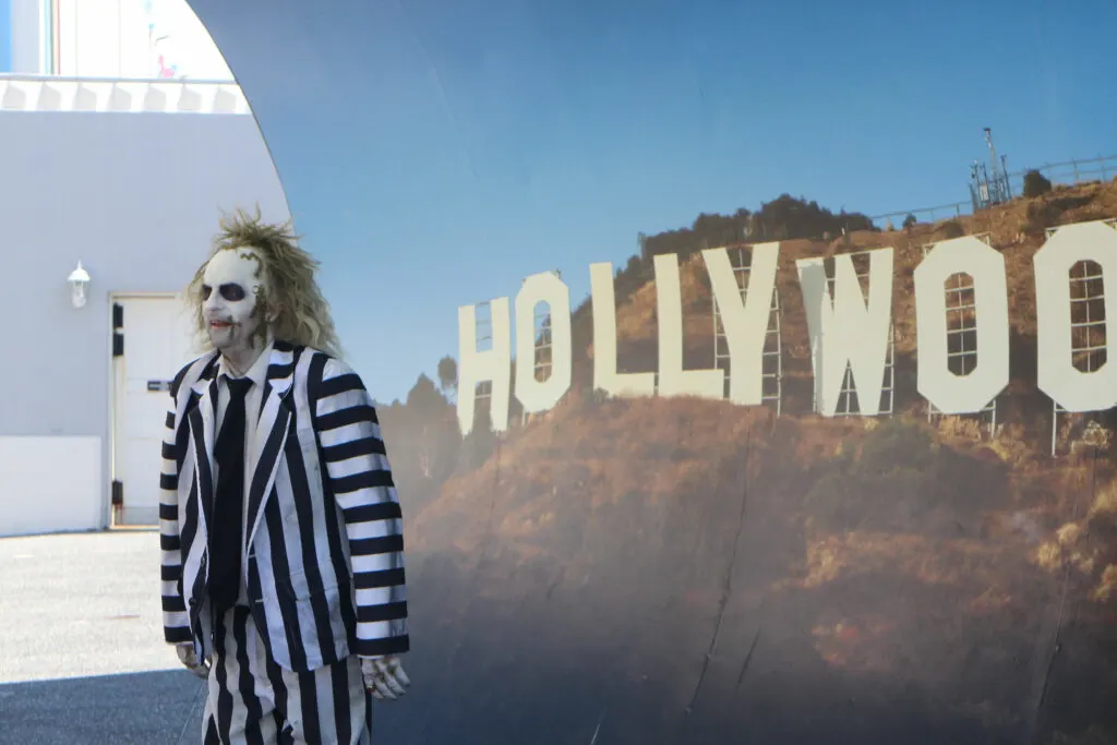 Beetlejuice character in front of a Hollywood sign backdrop at Universal Studios