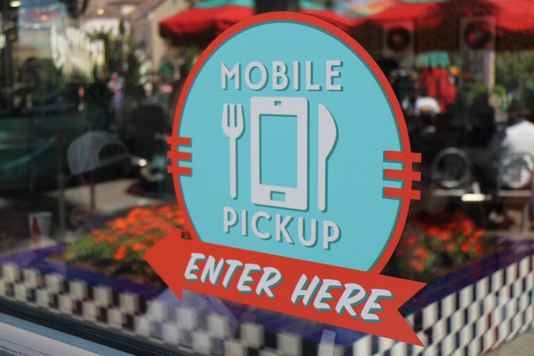sign for mobile order pickup on restaurant window