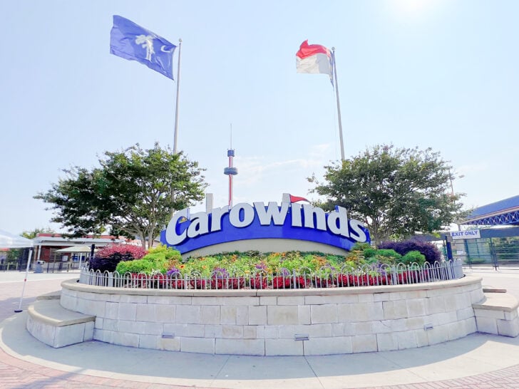 Carowinds entrance sign with North Carolina and South Carolina flags