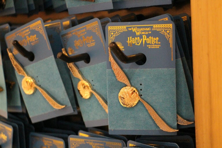 golden snitch pins for sale in Harry Potter world gift shop