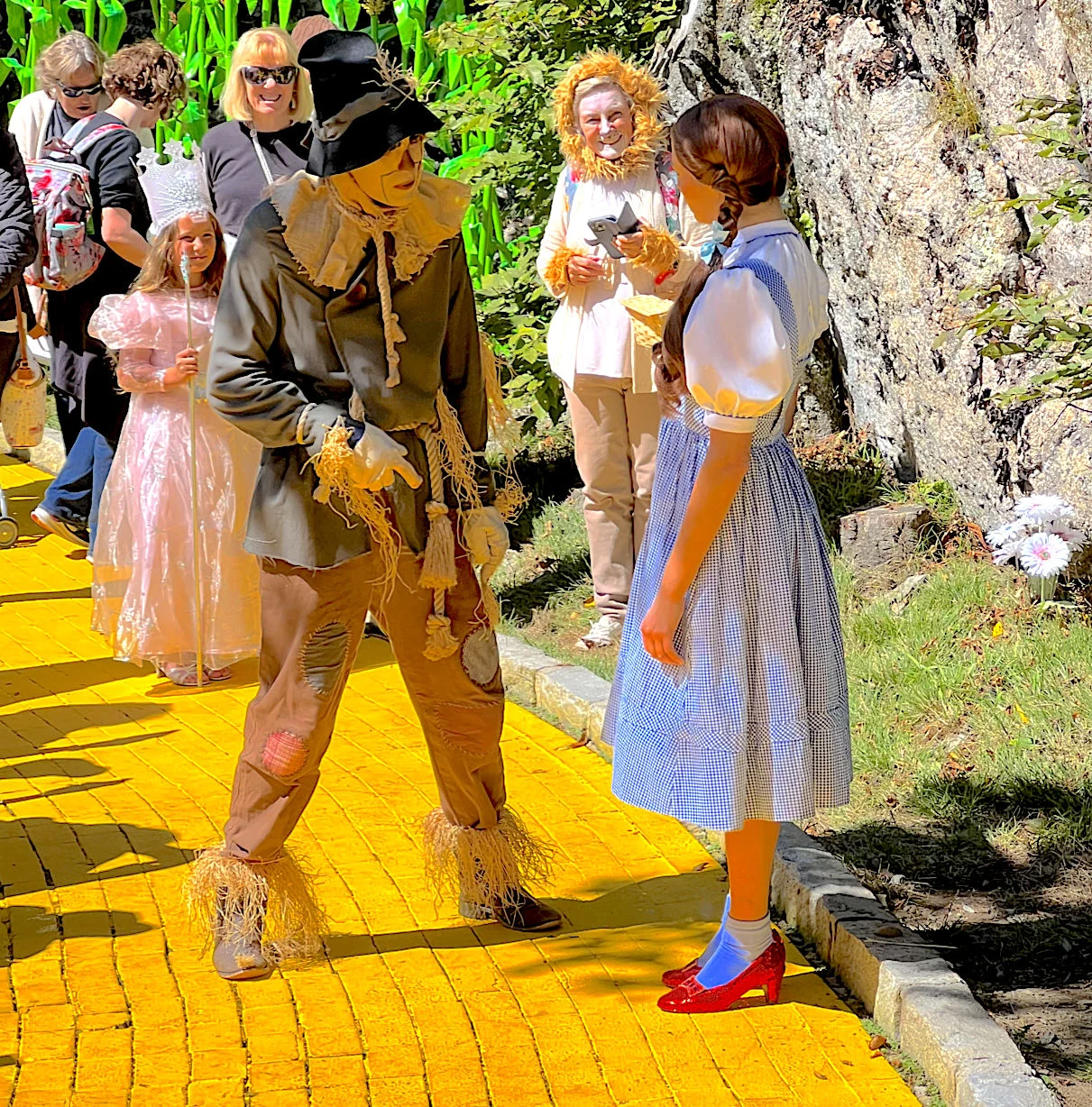 Land of Oz Theme Park Dorothy and Scarecrow Characters on Yellow Brick Road