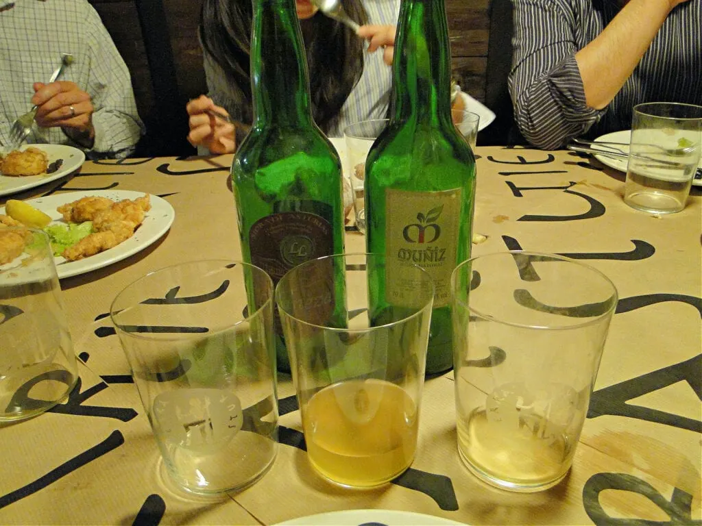 A group of people at a table in Asturias, Spain.