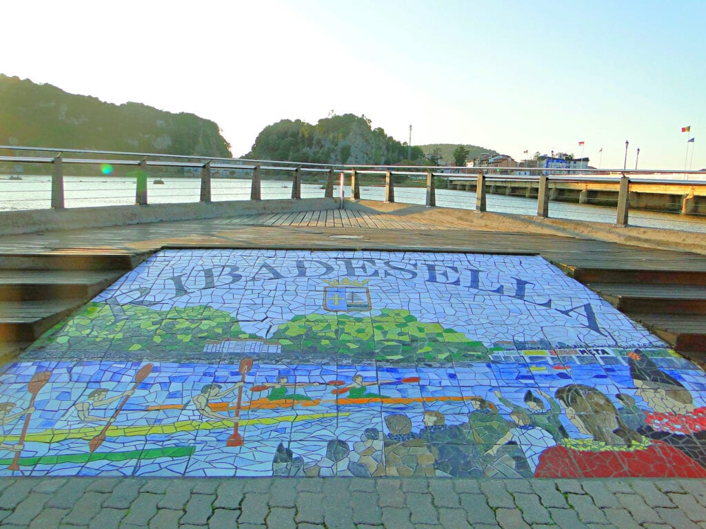 A tiled walkway with a picture of a boat in Asturias, Spain.
