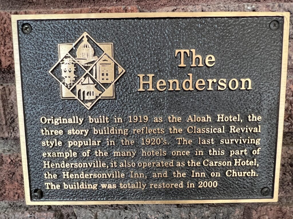 A plaque that reads The Henderson.